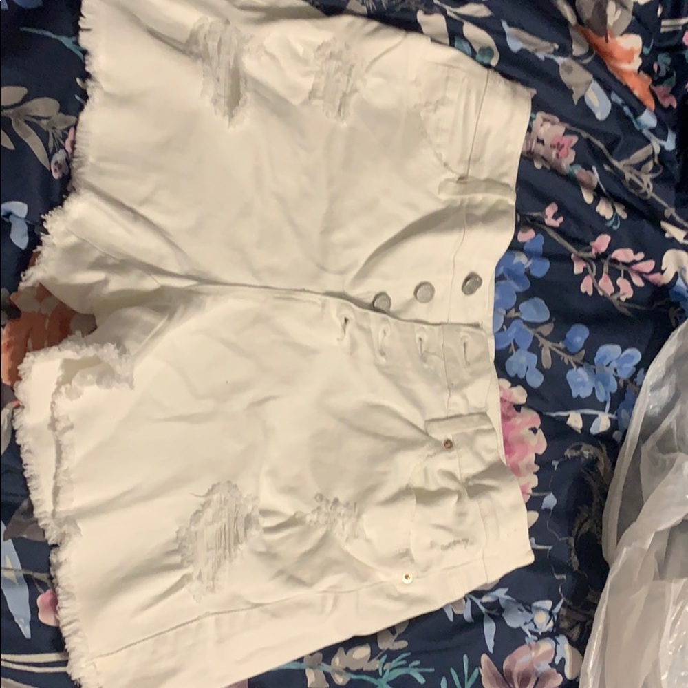 White ripped jean shorts